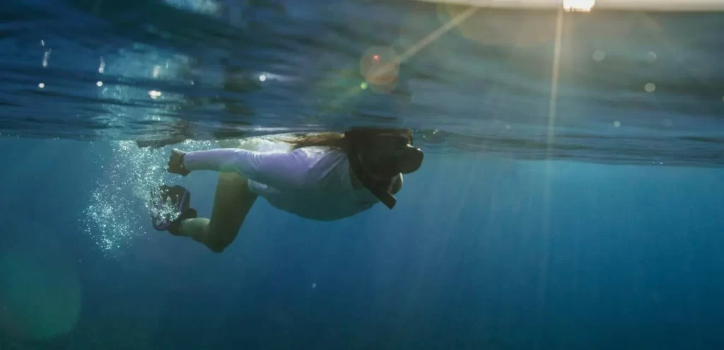 Woman snorkeling - True North