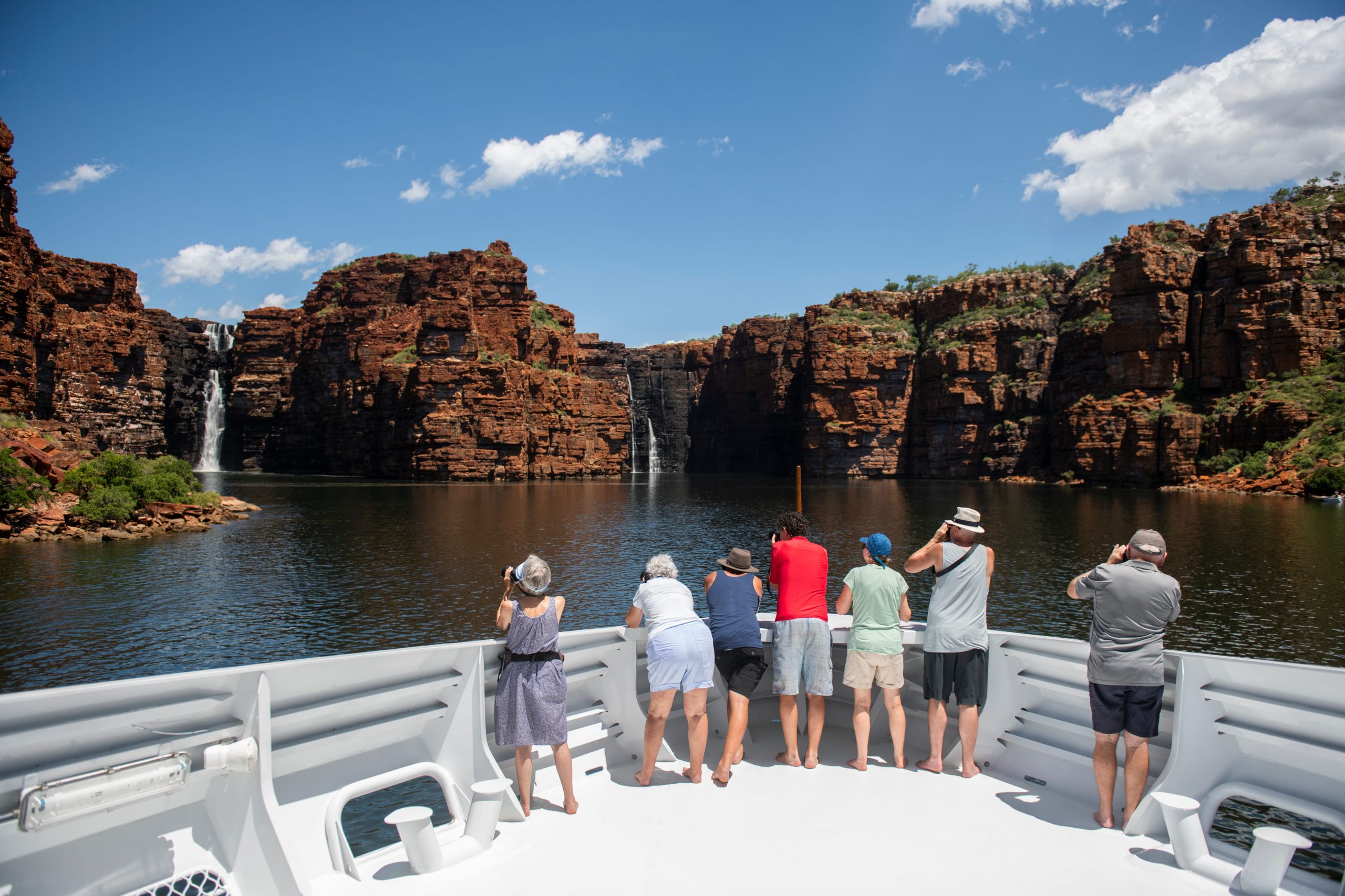 Aerial view of the luxury expedition vessel TRUE NORTH II cruising along the turquoise coastline near Esperance in Western Australia.