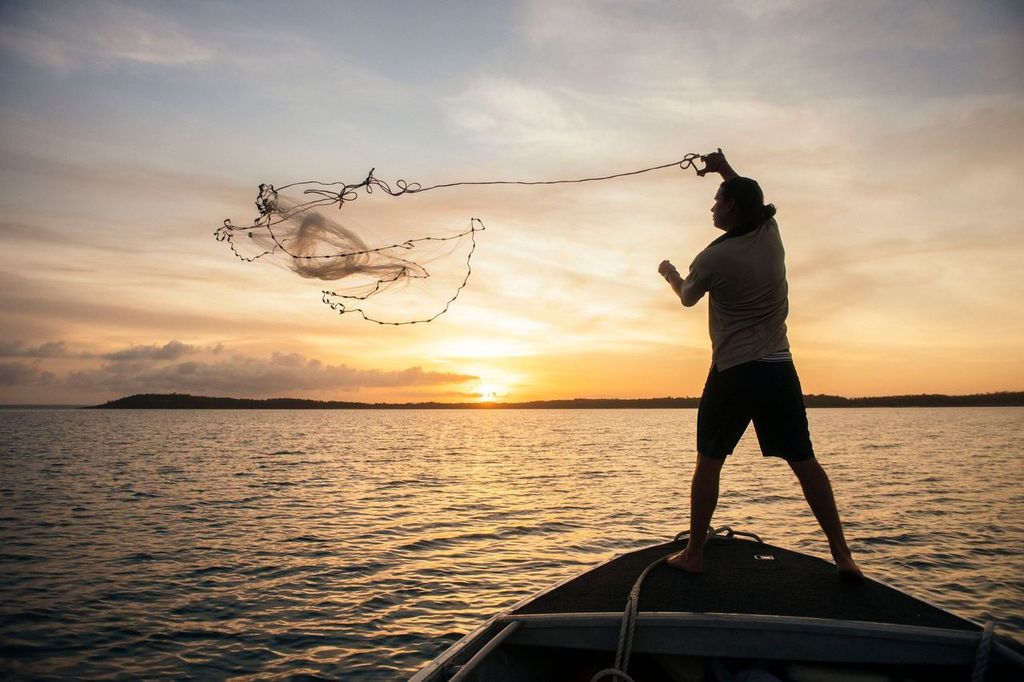 Fishing at sunrise: activity on True North luxury cruise