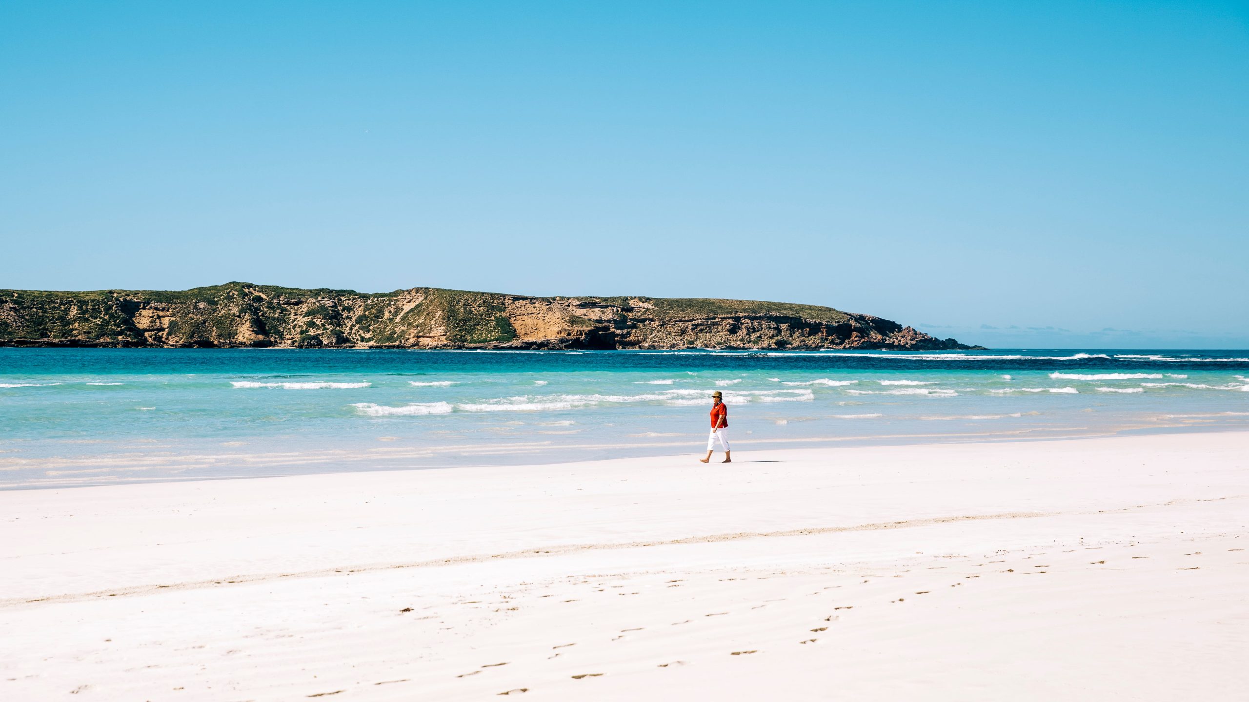 True North guest enjoying a coastal walk on Kangaroo Island during a South Australia expedition cruise.