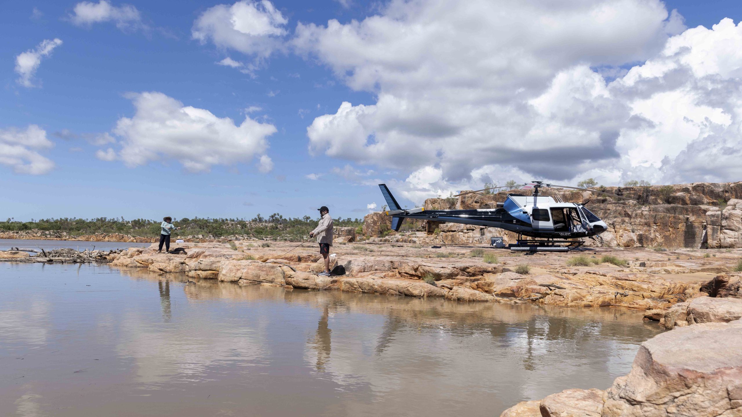 True North helicopter landing in remote Kimberley landscape during expedition cruise.
