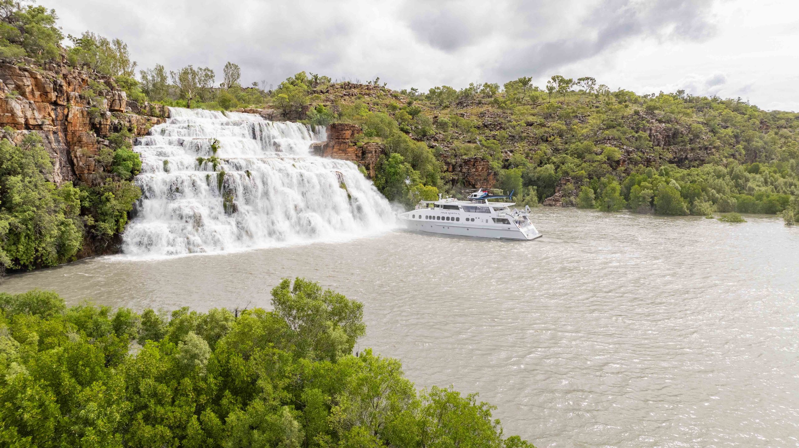 True North expedition vessel cruising through the Prince Regent River in the Kimberley, Western Australia