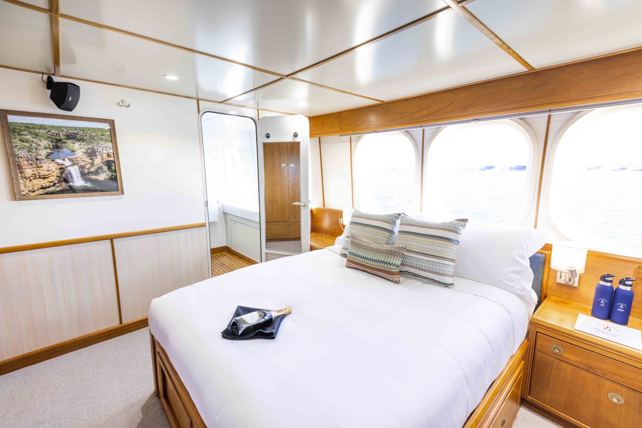Explorer Class staterooms feature a free standing queen size bed and a twin basin en-suite